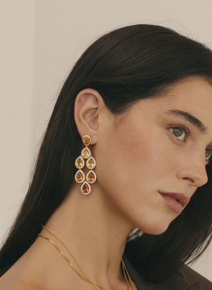 Woman wearing sapphire drop earring 